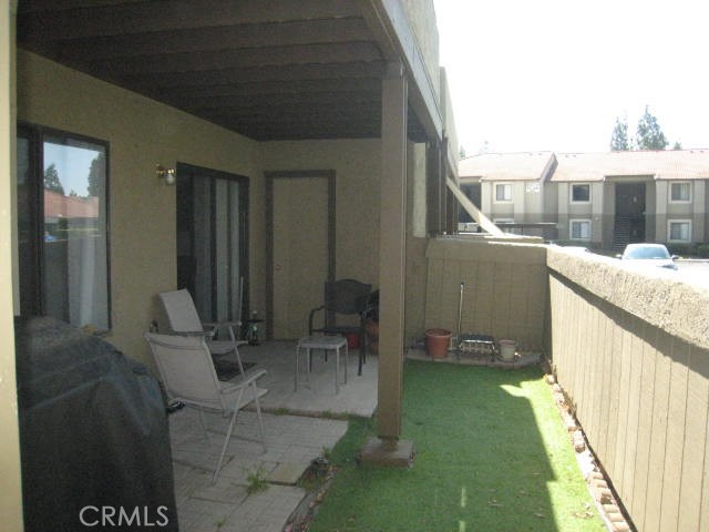 10151 Arrow Route, Unit 11 Rancho Cucamonga, CA 91730 - Photo 16 of 28 a balcony with chairs and a table
