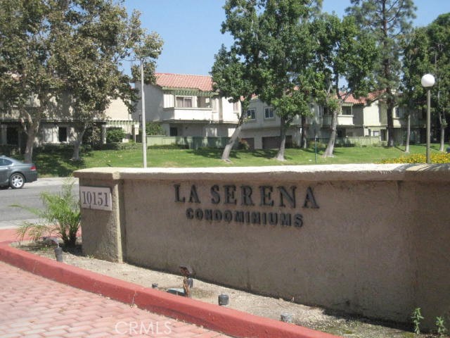 10151 Arrow Route, Unit 11 Rancho Cucamonga, CA 91730 - Photo 21 of 28 a view of a street with a building and trees in the background