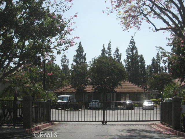 10151 Arrow Route, Unit 11 Rancho Cucamonga, CA 91730 - Photo 22 of 28 a front view of a house with a tree