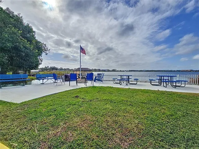 a view of a swimming pool with a yard