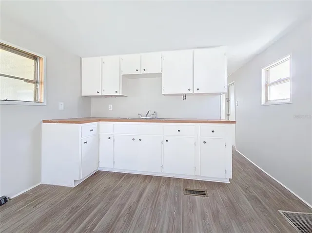 a view of kitchen with wooden floor