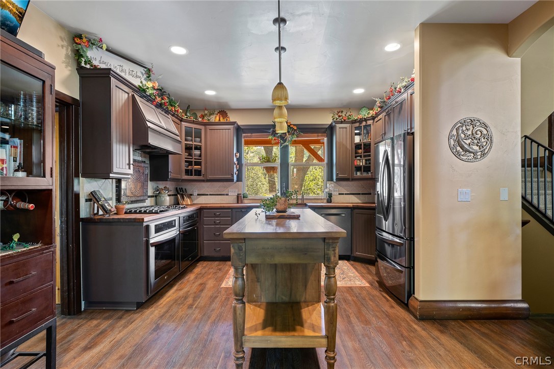 1224 Halifax Drive Lake Arrowhead, CA 92352 - Photo 11 of 35 a kitchen with kitchen island granite countertop wooden floors granite counter tops and a view of living room
