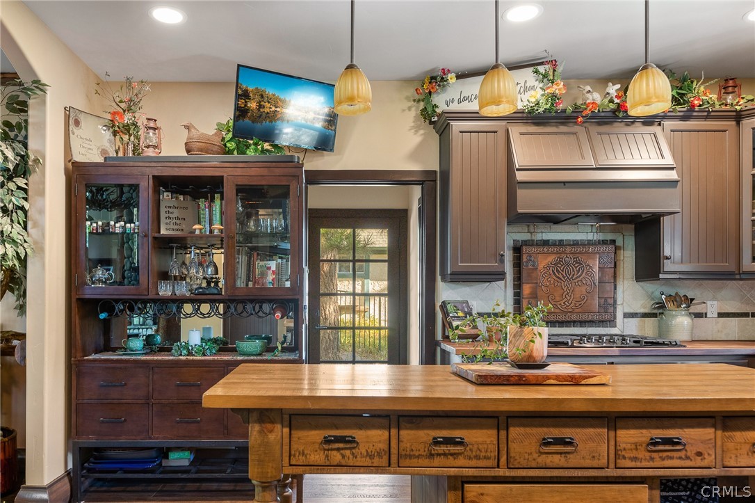 1224 Halifax Drive Lake Arrowhead, CA 92352 - Photo 12 of 35 a kitchen with a refrigerator and chandelier