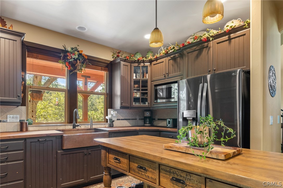 1224 Halifax Drive Lake Arrowhead, CA 92352 - Photo 14 of 35 a kitchen with stainless steel appliances a sink cabinets and a large window