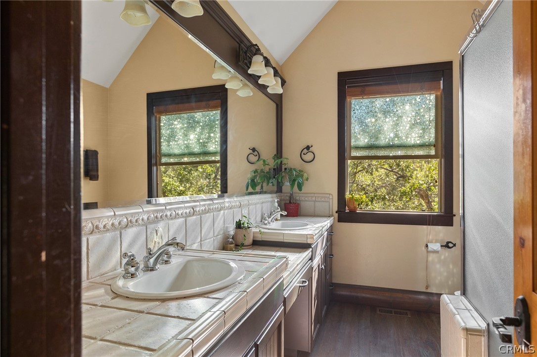 1224 Halifax Drive Lake Arrowhead, CA 92352 - Photo 23 of 35 a bathroom with a double vanity sink and a window