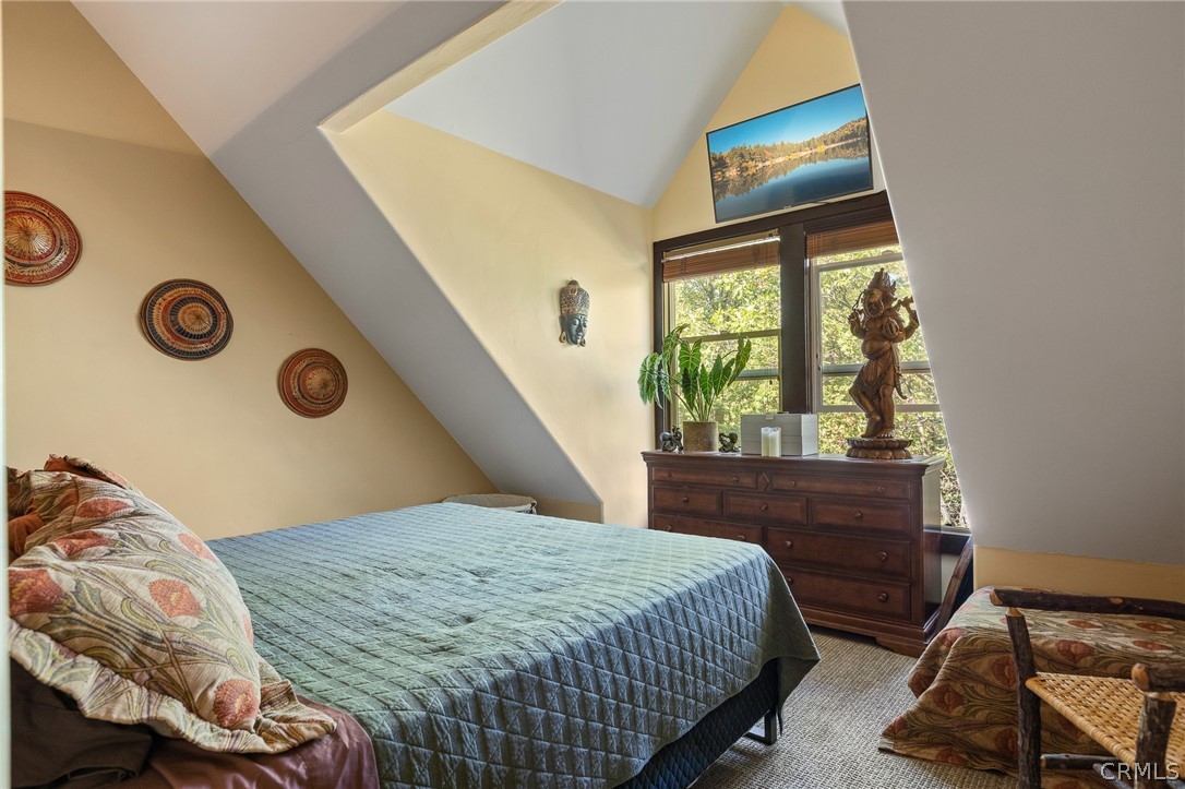 1224 Halifax Drive Lake Arrowhead, CA 92352 - Photo 24 of 35 a bedroom with a bed and a window