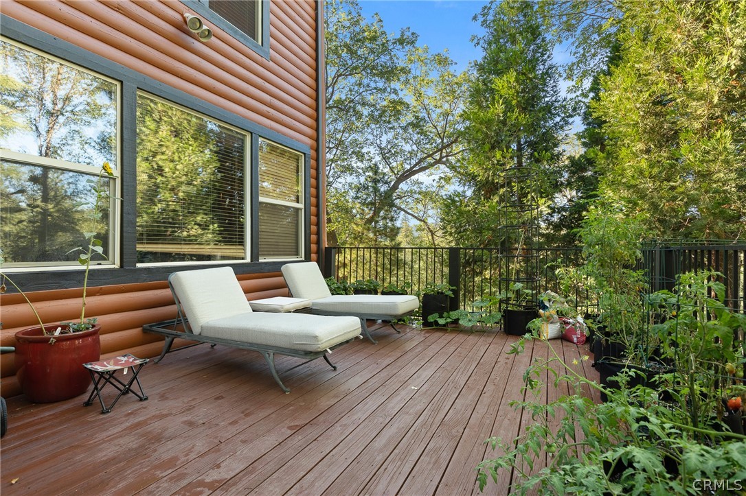 1224 Halifax Drive Lake Arrowhead, CA 92352 - Photo 29 of 35 a balcony with wooden floor and outdoor seating