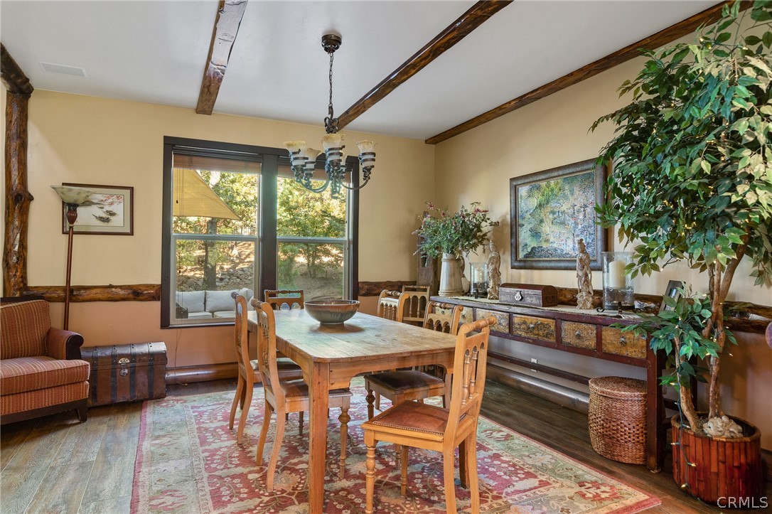 1224 Halifax Drive Lake Arrowhead, CA 92352 - Photo 9 of 35 a dining room with furniture a chandelier and wooden floor