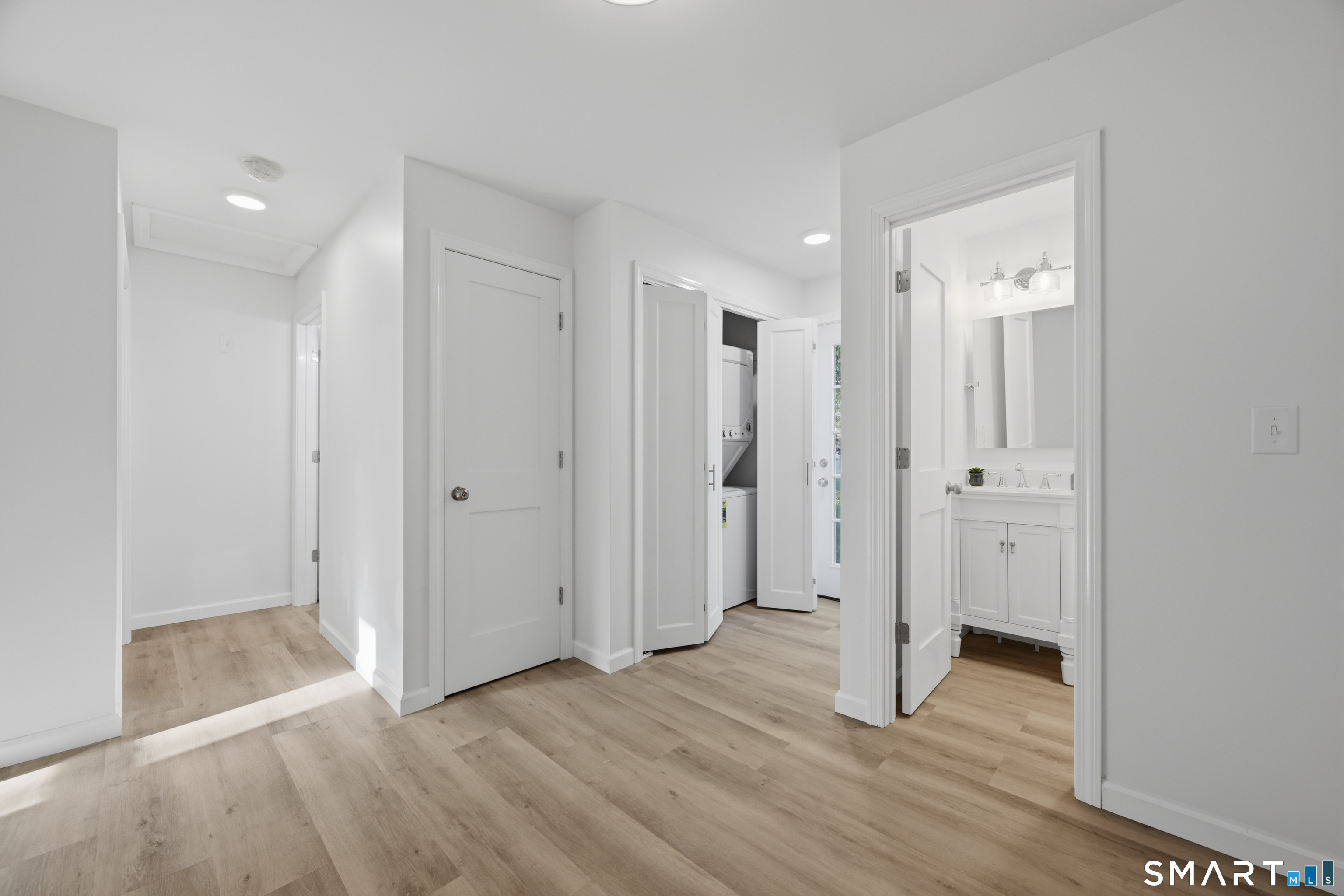 52 Chalker Beach Road Old Saybrook, CT 06475 - Photo 27 of 32 Open hallway which would make a great mudroom by laundry and back patio and yard