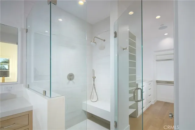 a bathroom with a shower and a sink