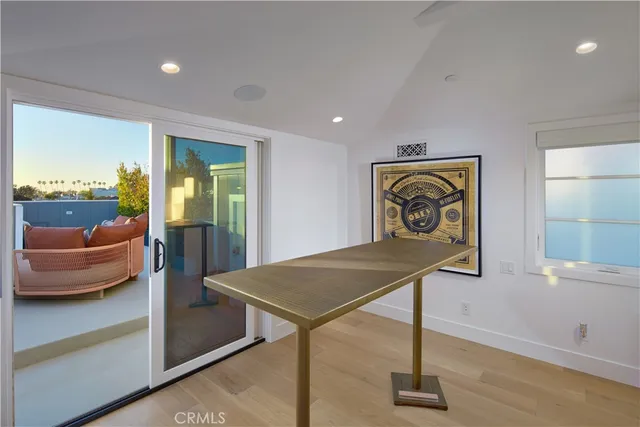 a view of a hallway with seating area