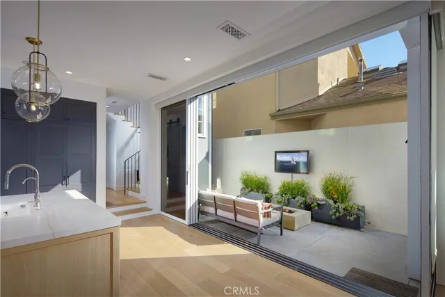 a bedroom with furniture and a potted plant