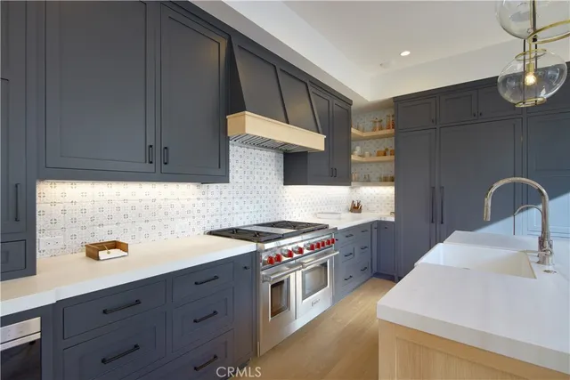 a kitchen with a stove and a sink