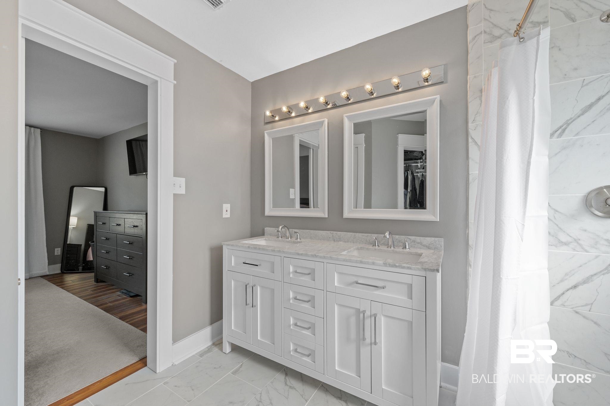 1107 North Oak Street Loxley, AL 36551 - Photo 14 of 40 Bathroom with vanity and a shower with curtain