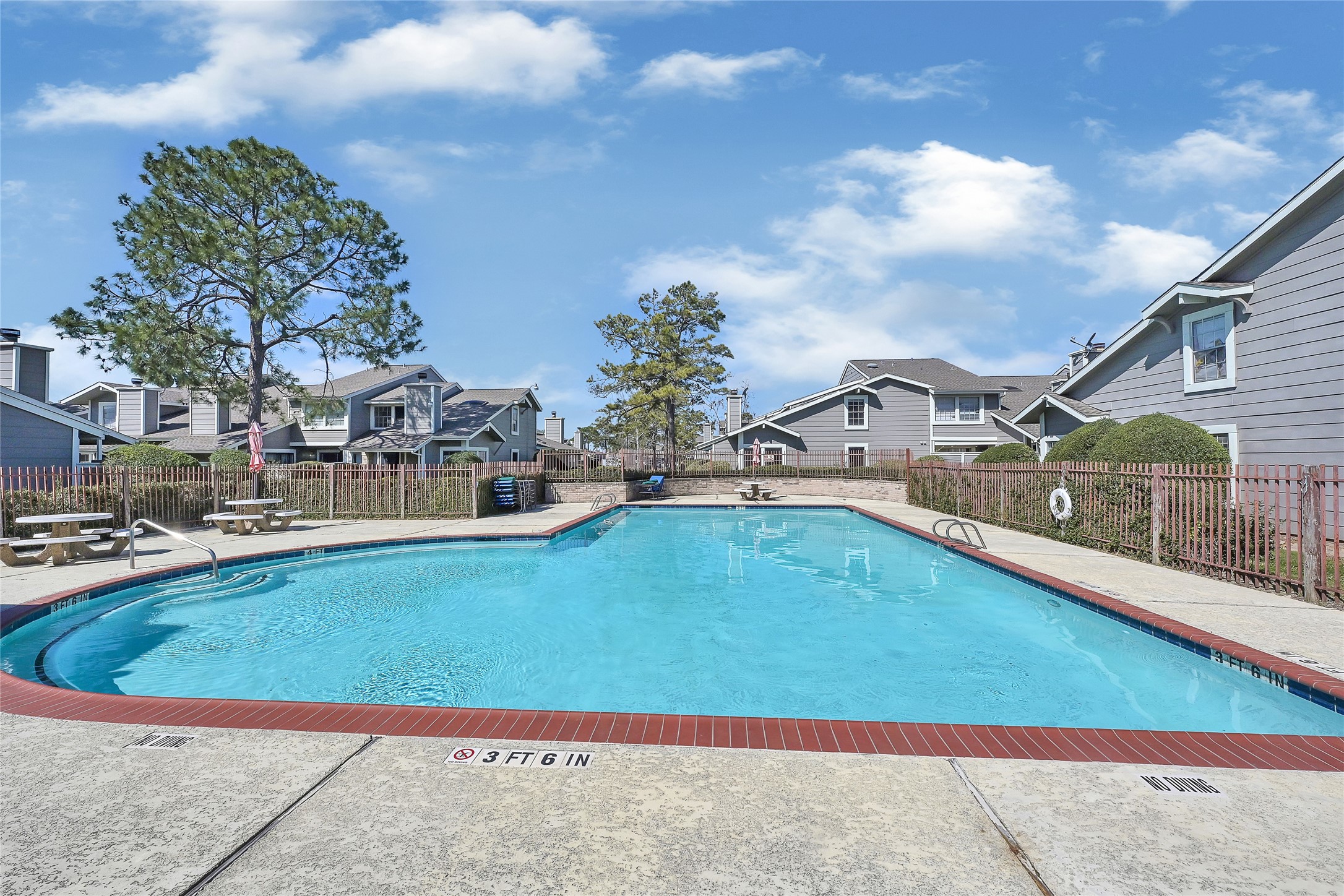 12111 Lemon Ridge Lane, Unit 121 Houston, TX 77035 - Photo 19 of 25 a view of a swimming pool with a yard