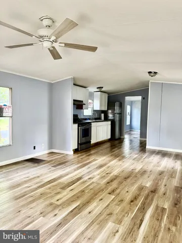 a view of room with window and hardwood