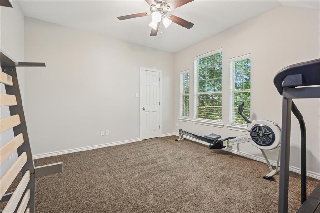 868 Valley Ridge Road Burleson, TX 76028 - Photo 28 of 40 a view of a room with gym equipment