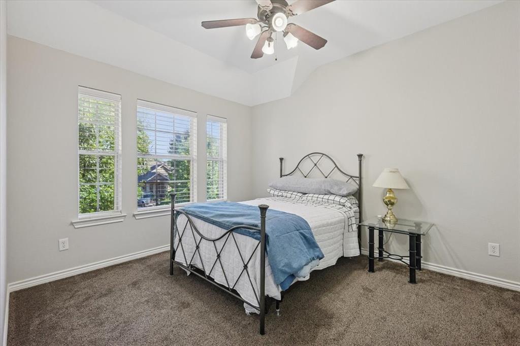 868 Valley Ridge Road Burleson, TX 76028 - Photo 30 of 40 a bedroom with a bed and a window