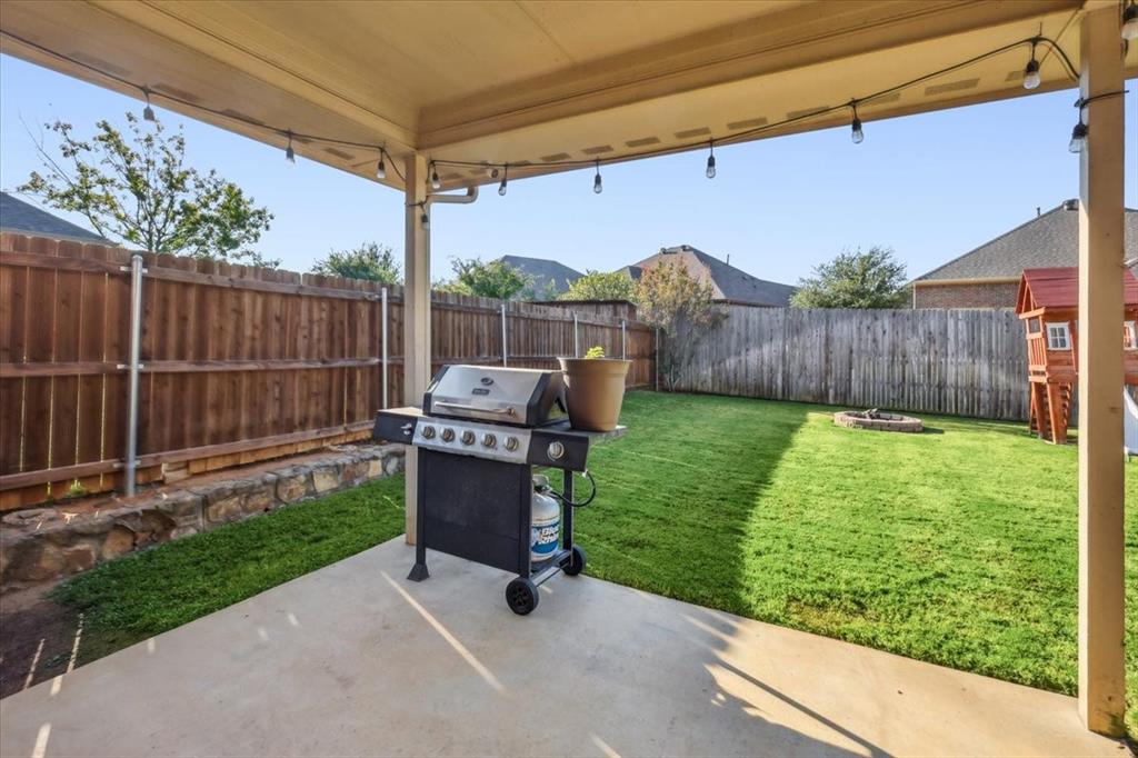 868 Valley Ridge Road Burleson, TX 76028 - Photo 40 of 40 a view of a backyard with wooden fence
