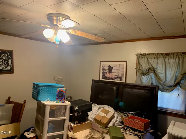 a living room with a couch and a dining table