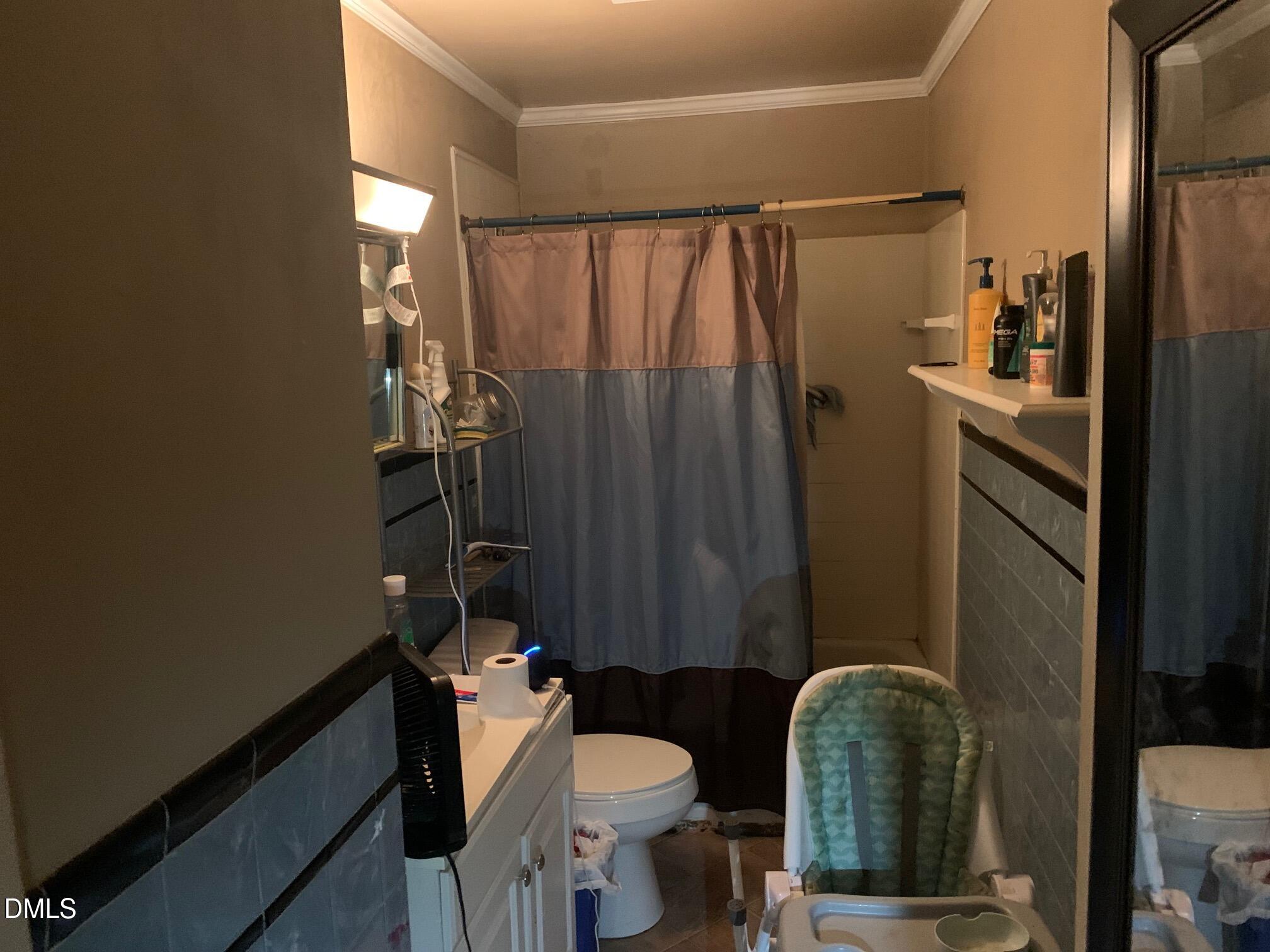 438 Dudley Street Burlington, NC 27217 - Photo 17 of 33 a bathroom with a sink toilet and shower