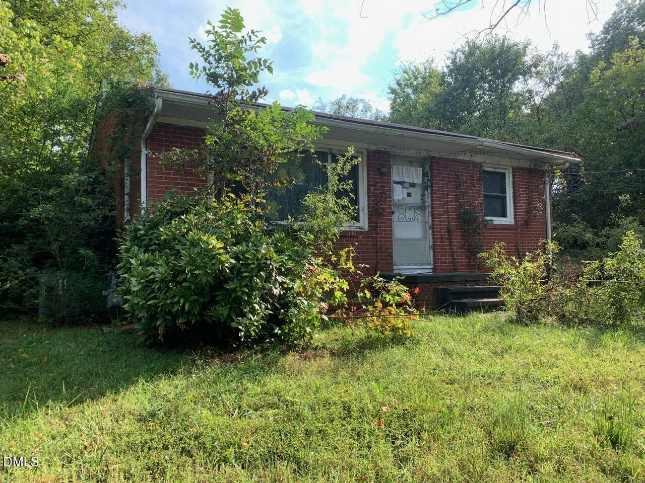 438 Dudley Street Burlington, NC 27217 - Photo 2 of 33 a view of a house with a yard and plants