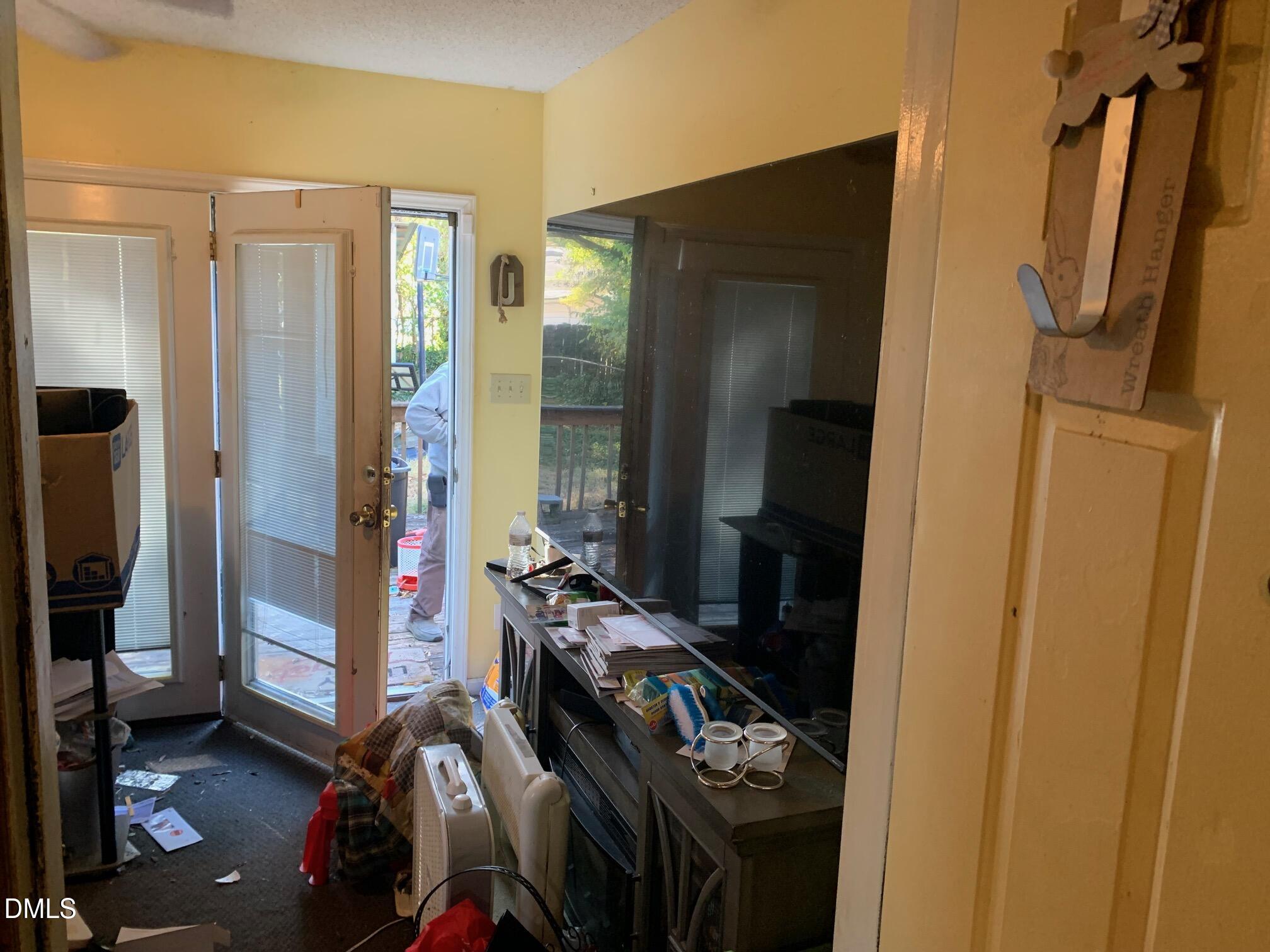 438 Dudley Street Burlington, NC 27217 - Photo 22 of 33 a room with lots of stuff and hardwood floor