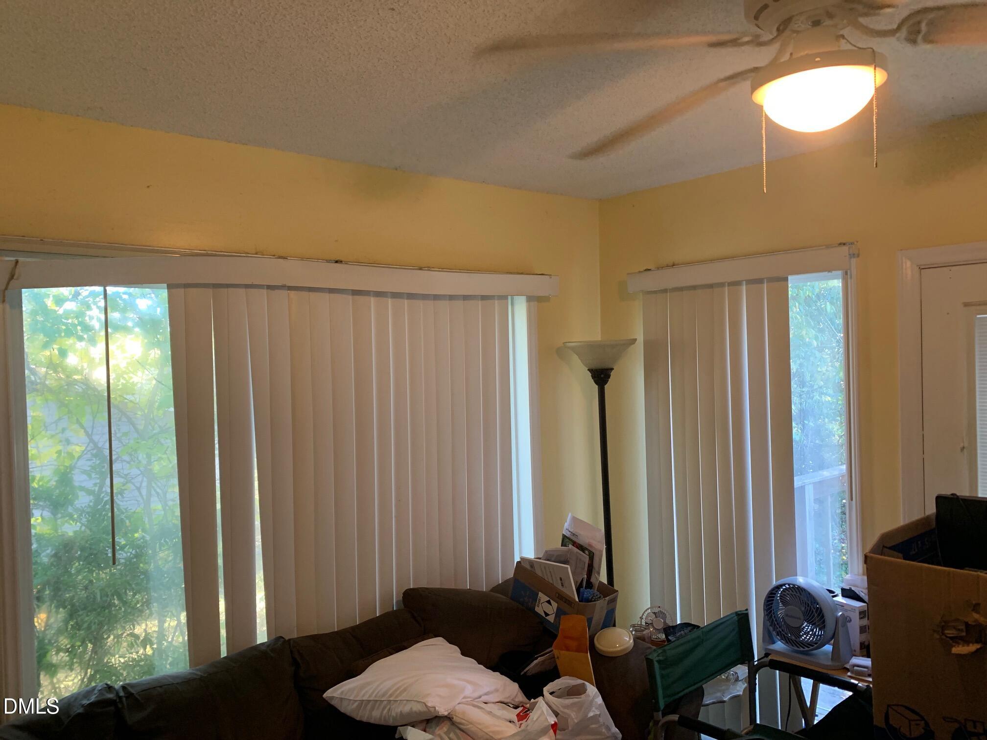 438 Dudley Street Burlington, NC 27217 - Photo 23 of 33 a living room with furniture and a window