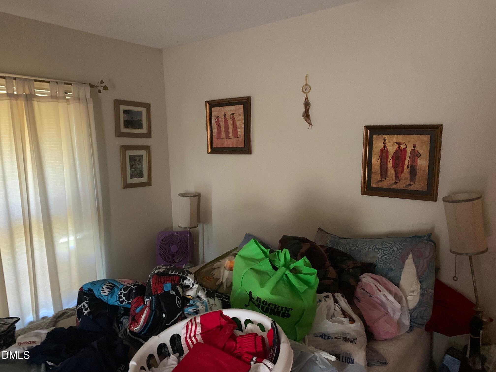 438 Dudley Street Burlington, NC 27217 - Photo 24 of 33 a bedroom with furniture and a window
