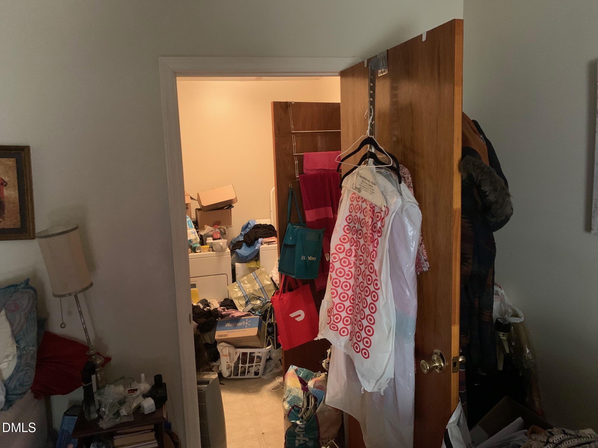 438 Dudley Street Burlington, NC 27217 - Photo 25 of 33 a view of walk in closet with clothes and shoes