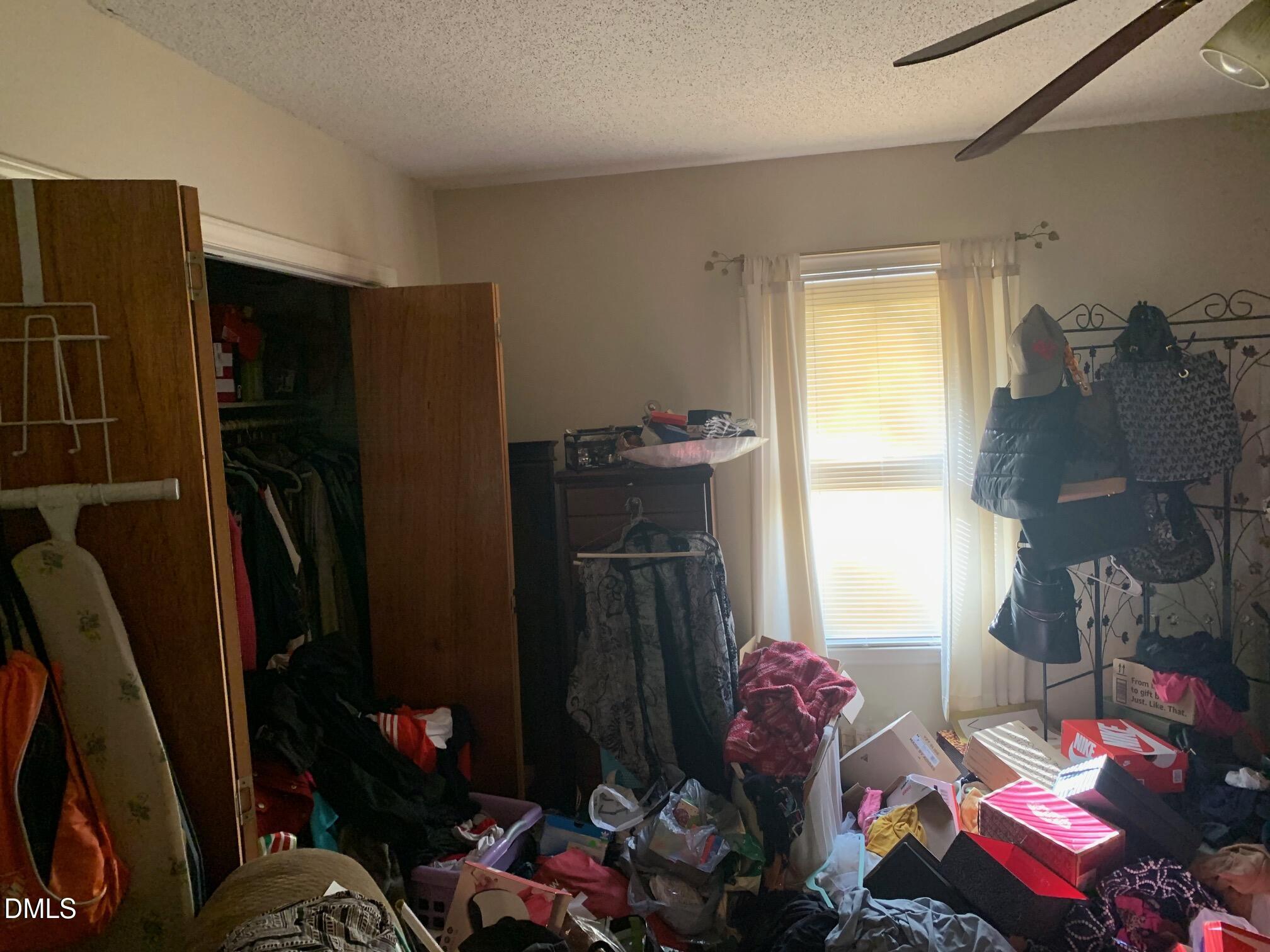 438 Dudley Street Burlington, NC 27217 - Photo 26 of 33 a bedroom with a bed and a closet