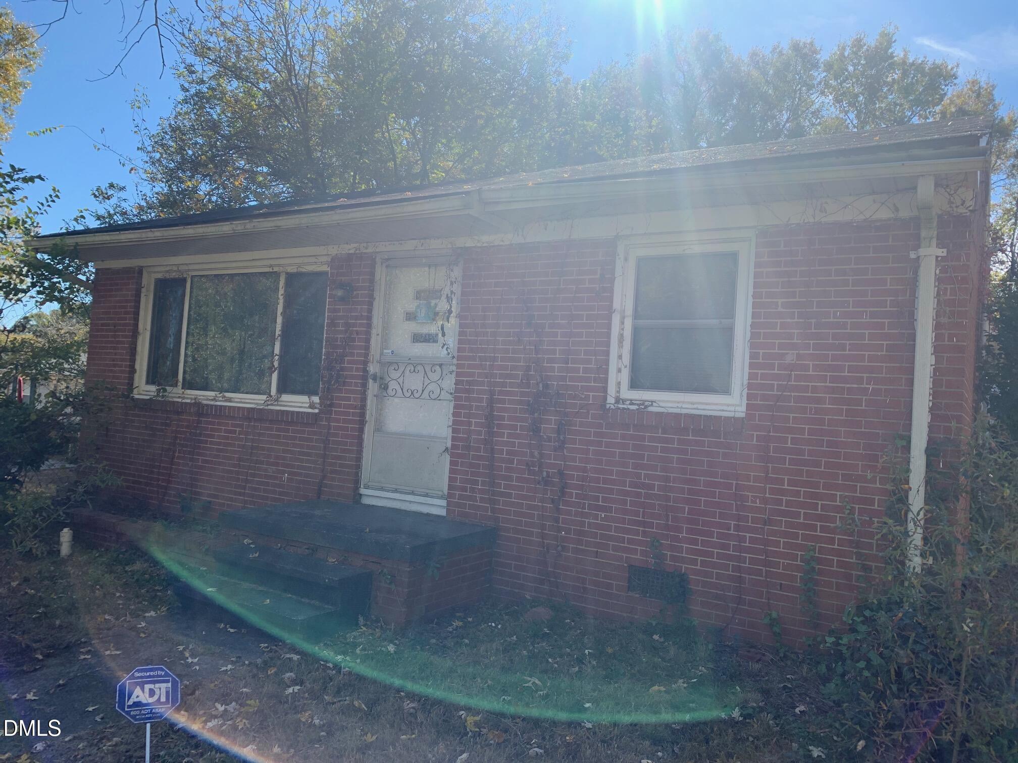 438 Dudley Street Burlington, NC 27217 - Photo 32 of 33 a view of a brick house with a yard