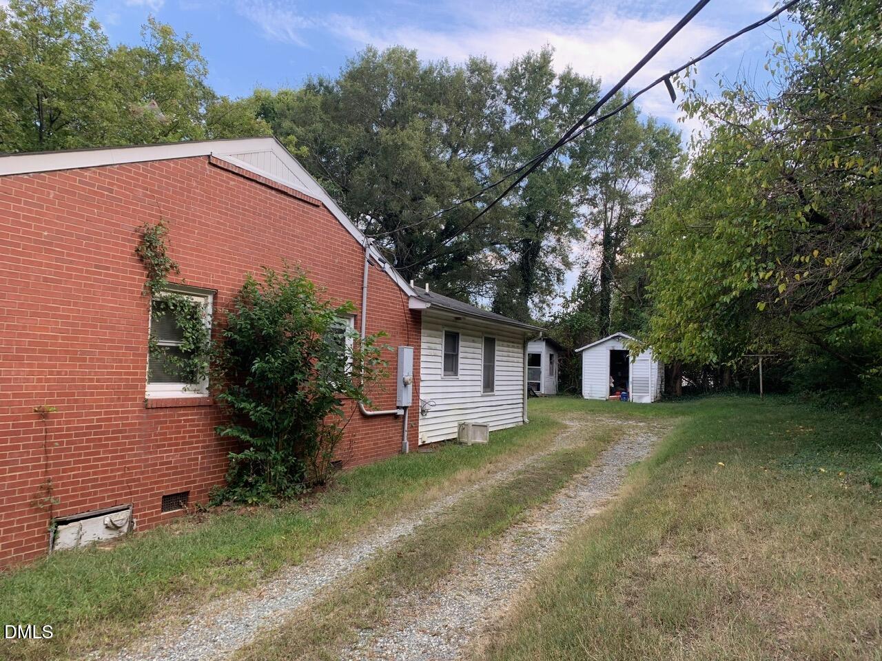 438 Dudley Street Burlington, NC 27217 - Photo 4 of 33 a view of a house with a yard and large tree