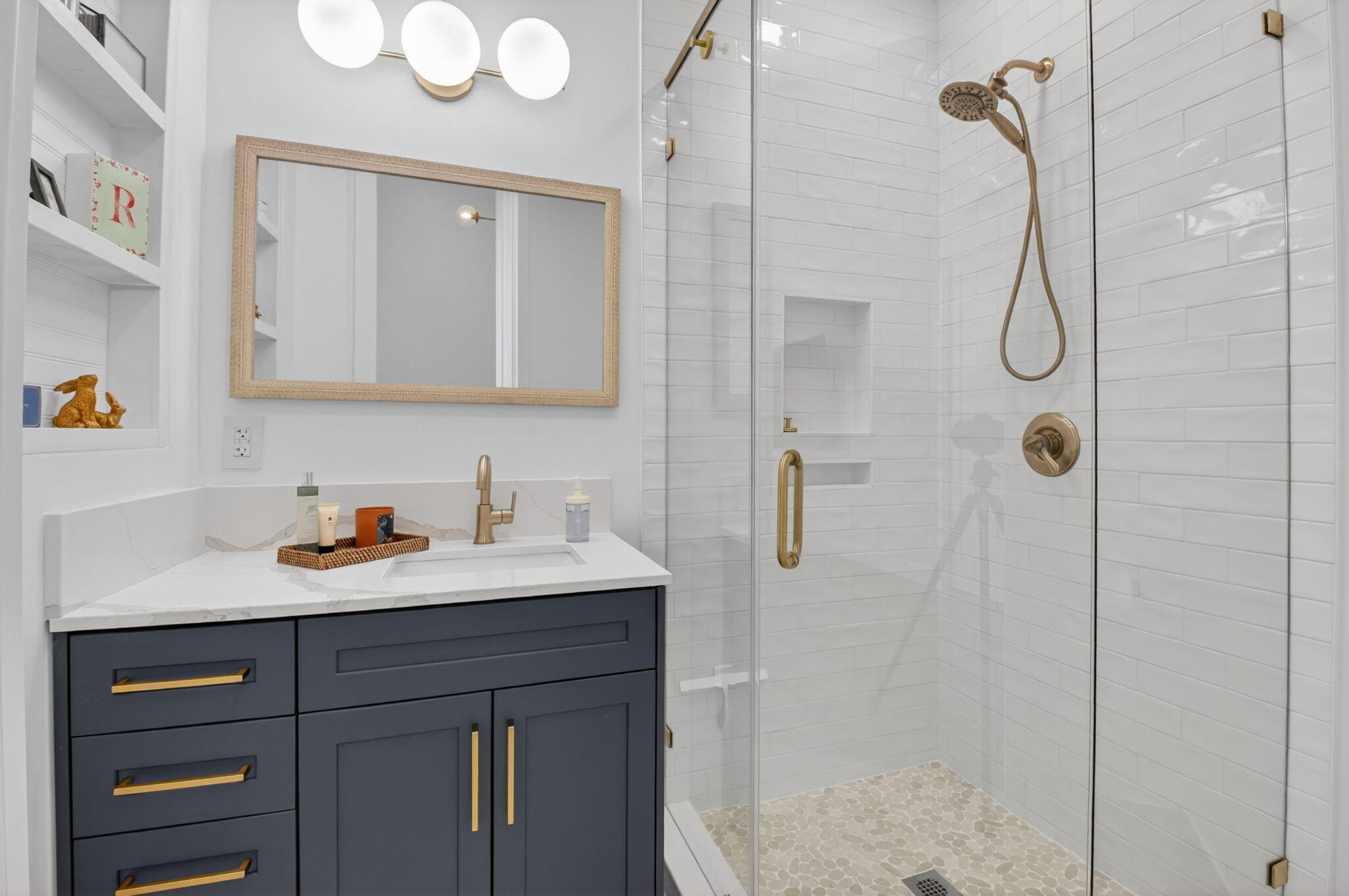 17108 Newport Club Drive Boca Raton, FL 33496 - Photo 17 of 39 a bathroom with a shower sink vanity and mirror