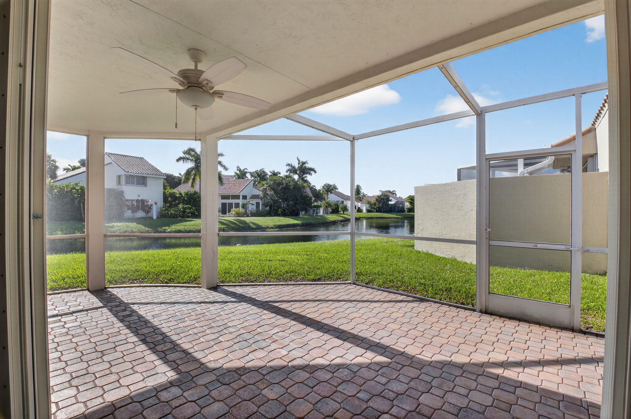 17108 Newport Club Drive Boca Raton, FL 33496 - Photo 21 of 39 a view of a porch with wooden floor and a yard