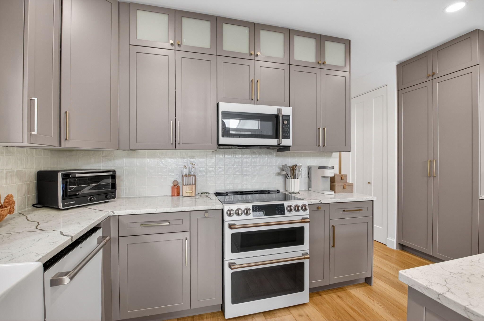 17108 Newport Club Drive Boca Raton, FL 33496 - Photo 6 of 39 a kitchen with stainless steel appliances granite countertop a stove microwave and cabinets