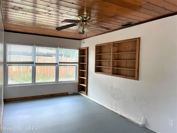 a utility room with cabinets dryer and washer