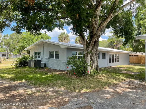 a view of a swimming pool with a yard