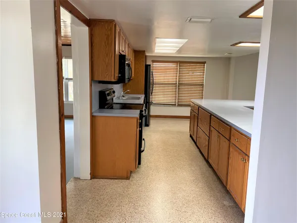 a view of a kitchen with a sink