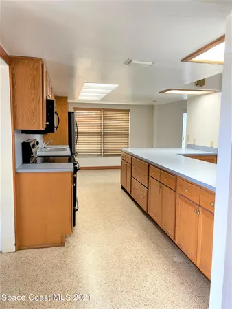a view of a kitchen with a sink