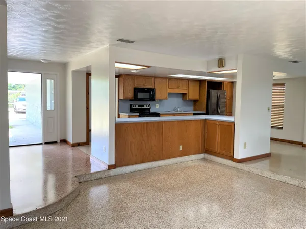a view of a kitchen with a sink