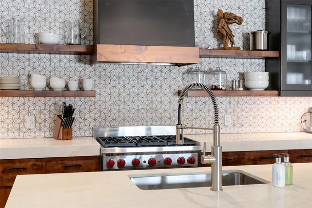 a kitchen with a stove and cabinets