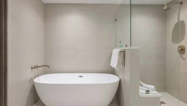 a white bath tub sitting in a bathroom
