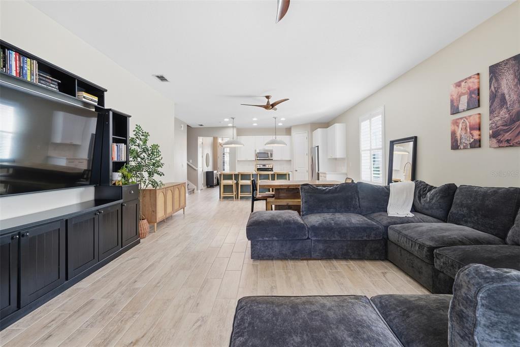 5232 Bentgrass Way Bradenton, FL 34211 - Photo 13 of 57 a living room with furniture and a flat screen tv