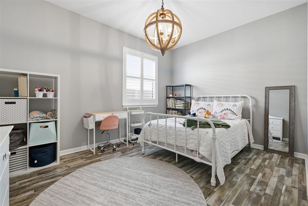 5232 Bentgrass Way Bradenton, FL 34211 - Photo 23 of 57 a bedroom with bed and window