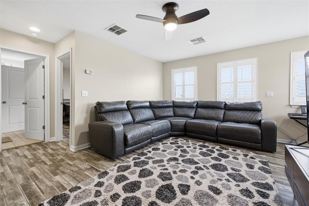 5232 Bentgrass Way Bradenton, FL 34211 - Photo 30 of 57 a living room with furniture and a rug