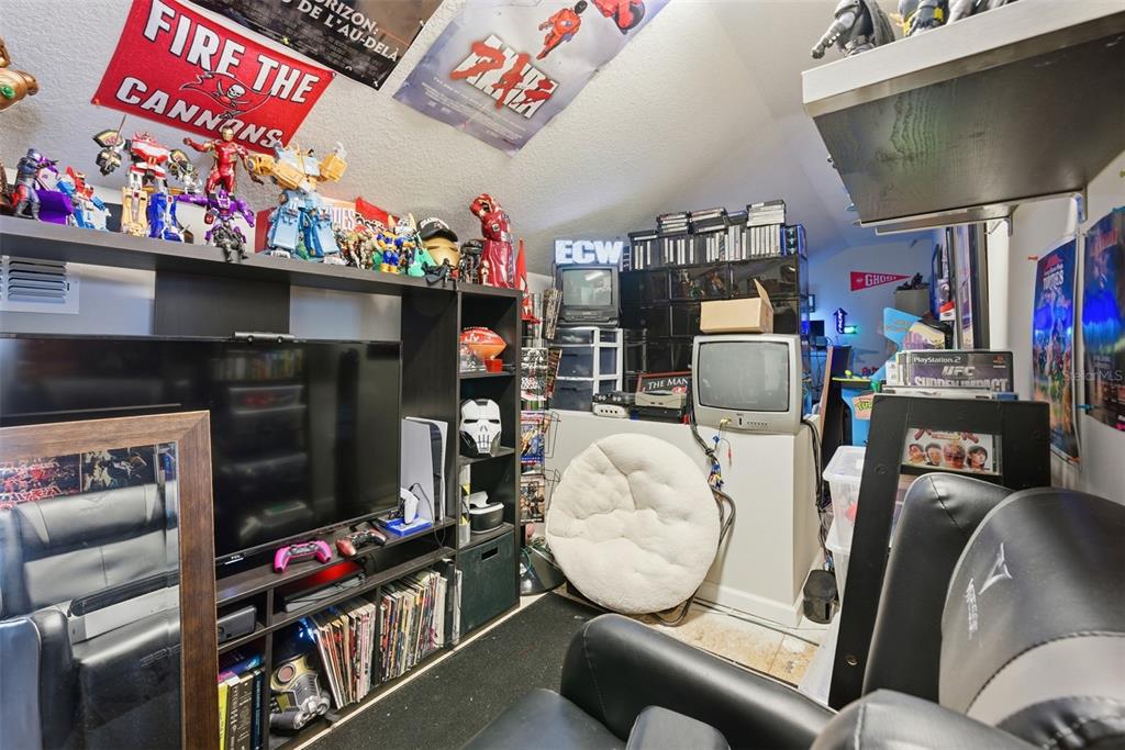 5232 Bentgrass Way Bradenton, FL 34211 - Photo 34 of 57 a room with furniture and a flat screen tv