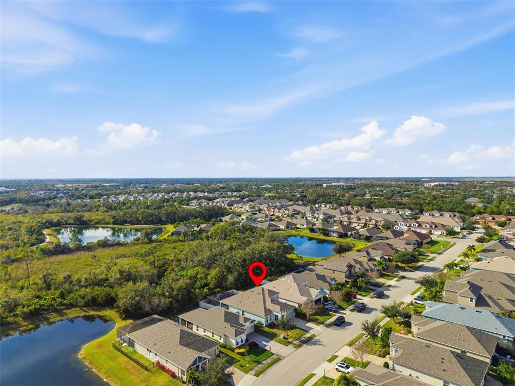 5232 Bentgrass Way Bradenton, FL 34211 - Photo 46 of 57 an aerial view of a houses with a swimming pool