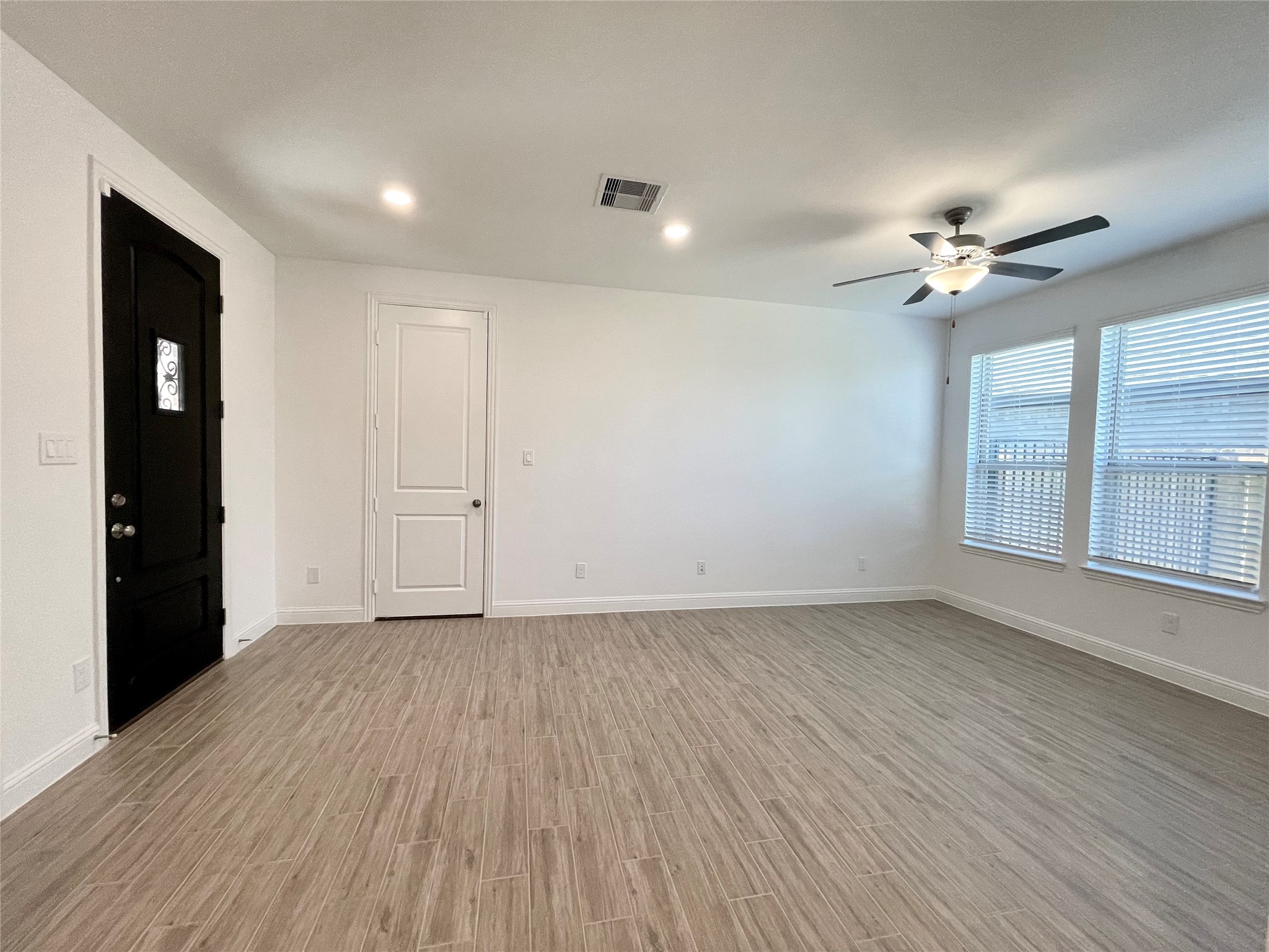 29806 Cherry Vine Road Katy, TX 77494 - Photo 29 of 30 wooden floor in an empty room with a window