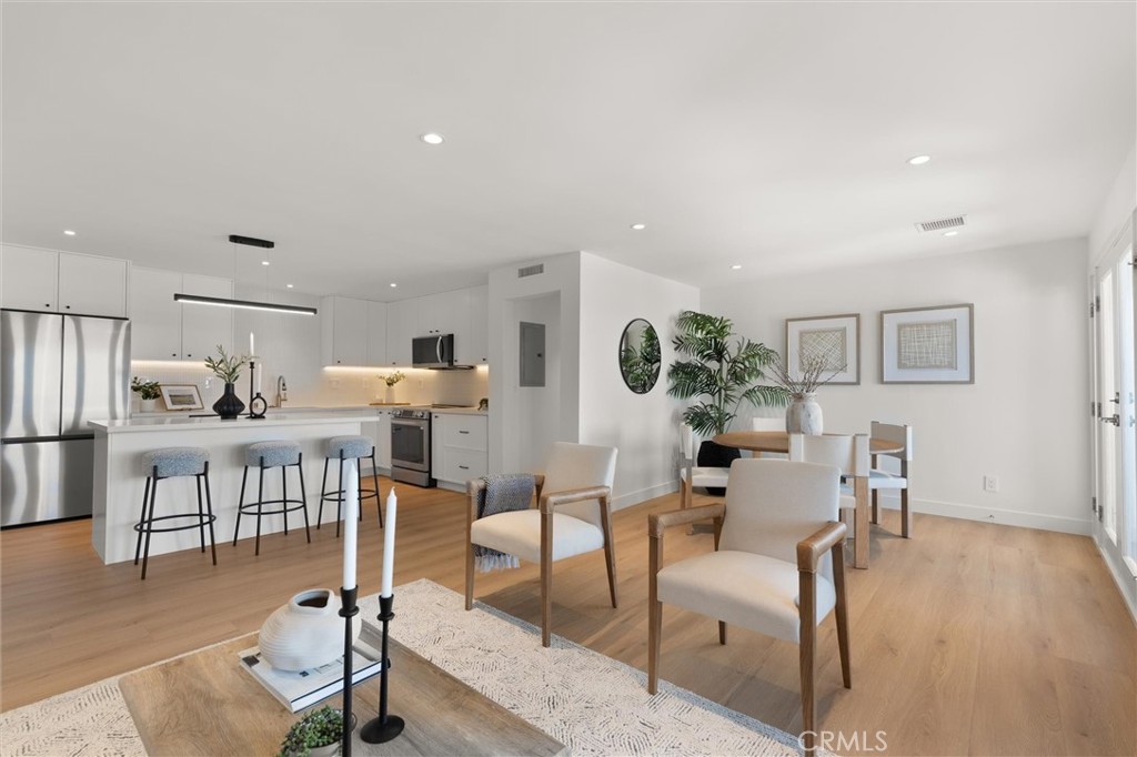 1200 East Ocean Boulevard, Unit 41 Long Beach, CA 90802 - Photo 14 of 35 a living room with furniture and a wooden floor